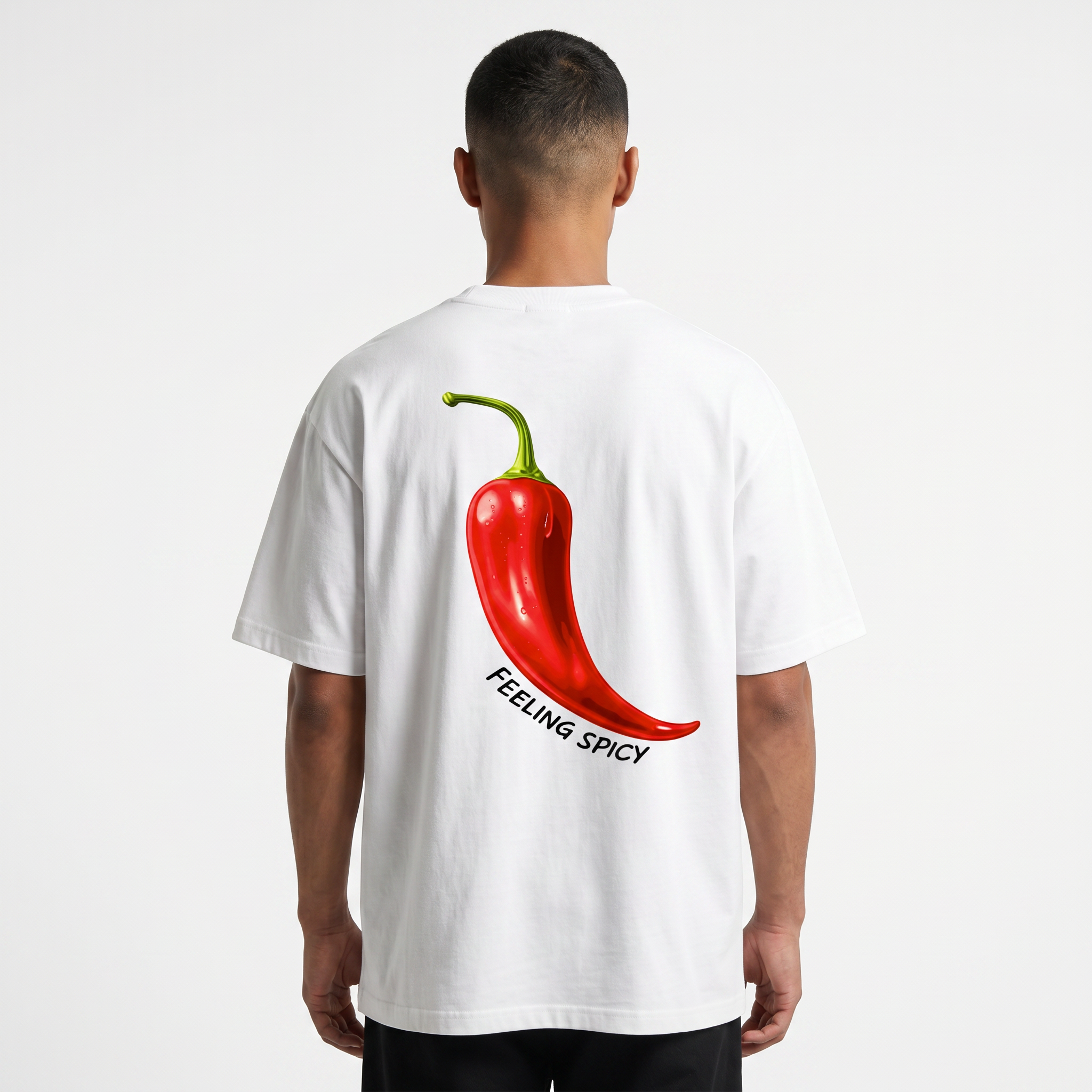 Person wearing a white t-shirt with a red chili pepper graphic and 'Feeling Spicy' text on the back.